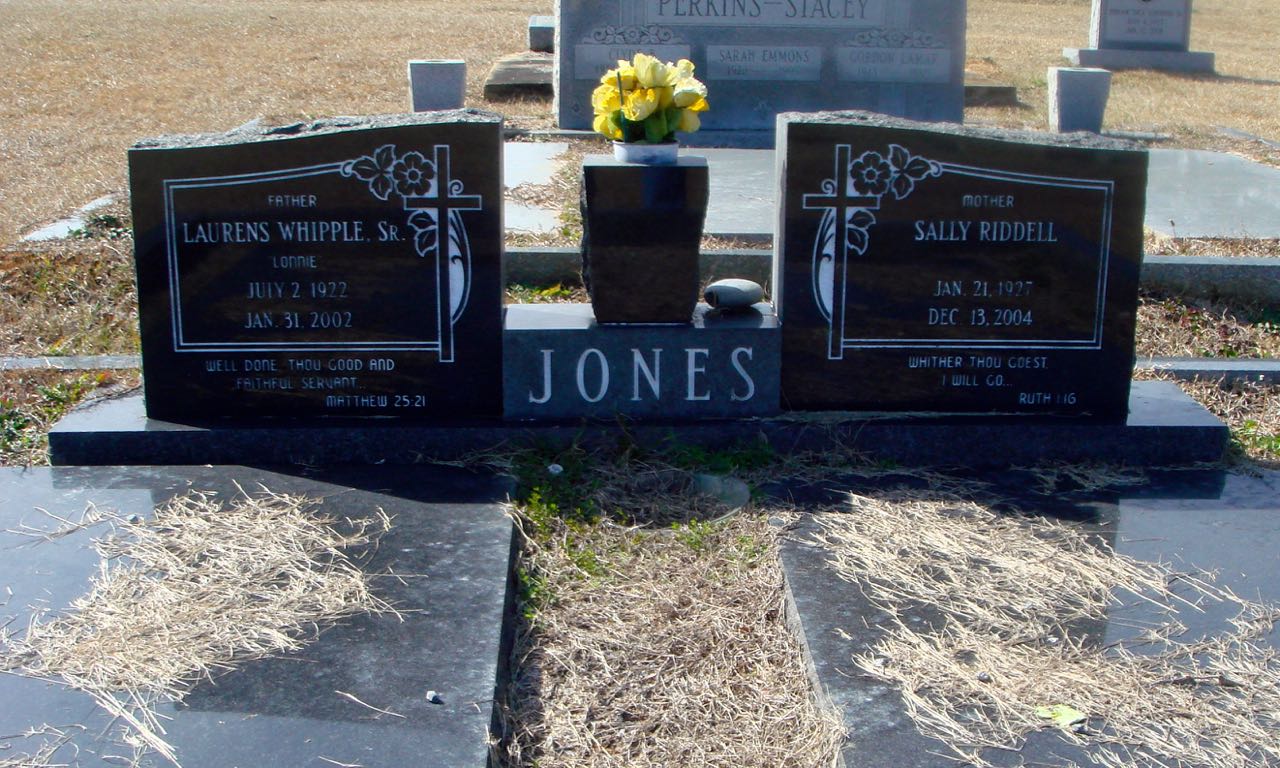 The Jones family monument at Bay Minette Cemetery — twin granite uprights for Laurens Whipple Jones Sr. and Sally Riddell Jones, with JONES across the base.